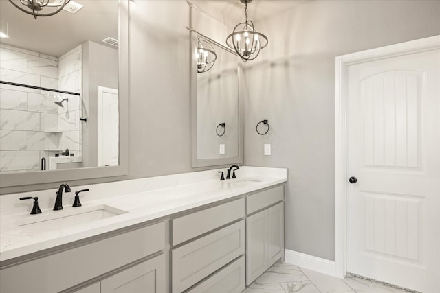 full bathroom featuring double vanity, marble finish floor, visible vents, and a sink