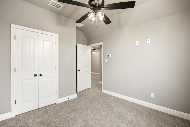 unfurnished bedroom featuring a closet, visible vents, baseboards, and carpet flooring