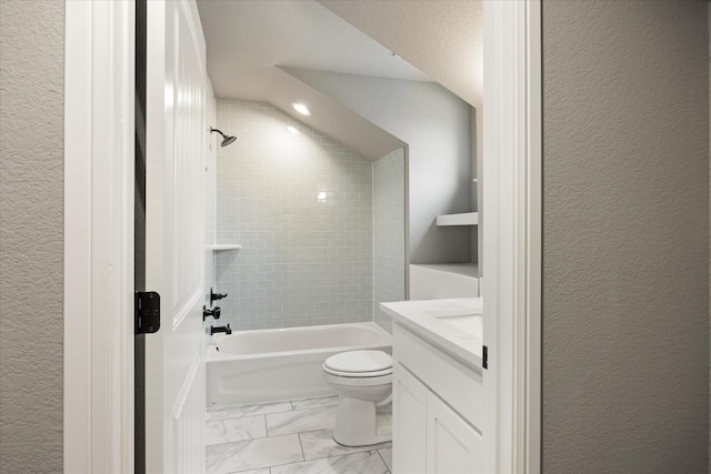 bathroom featuring marble finish floor, shower / bathtub combination, a textured wall, toilet, and vanity