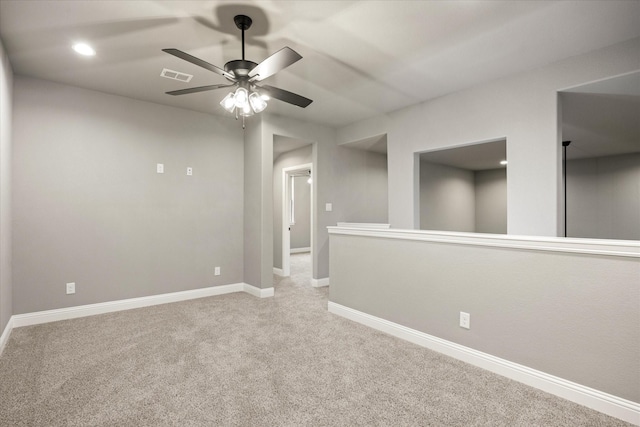 carpeted empty room with baseboards, visible vents, ceiling fan, and recessed lighting