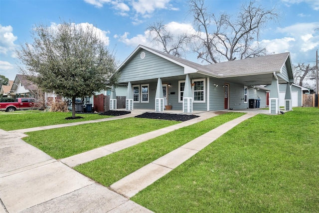 bungalow featuring a carport, a front lawn, a porch, and a shingled roof