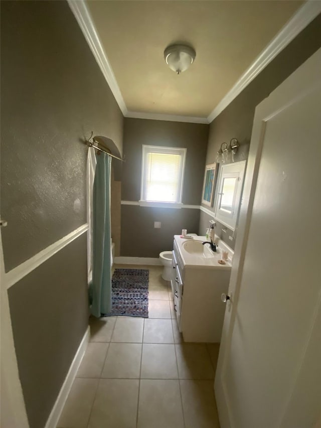 full bath featuring toilet, ornamental molding, shower / tub combo, vanity, and tile patterned floors