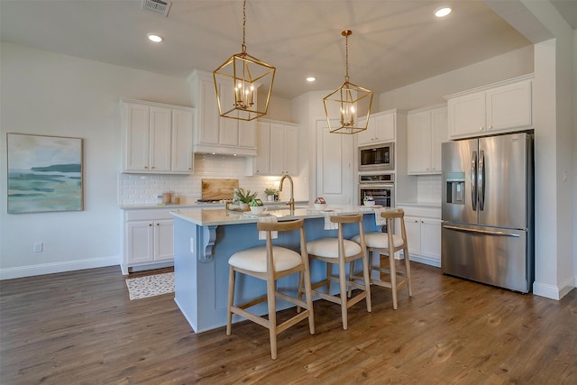 kitchen featuring stainless steel appliances and white cabinetry