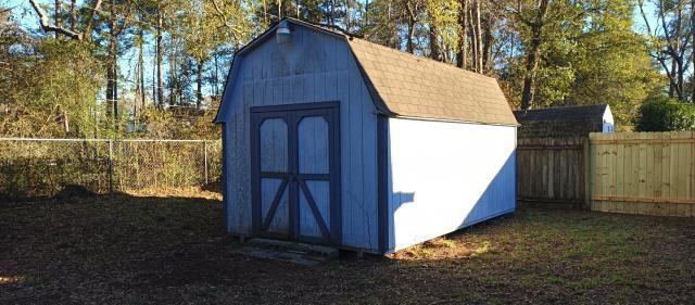 view of shed with a fenced backyard