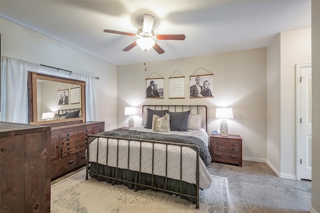 bedroom featuring ceiling fan and baseboards