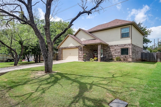 view of front of home featuring driveway, brick siding, a front yard, and fence