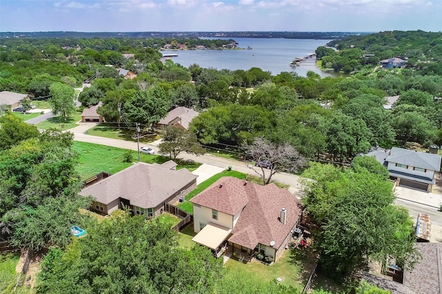 drone / aerial view featuring a residential view and a water view