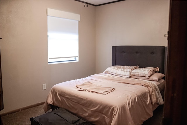 bedroom with carpet floors and baseboards