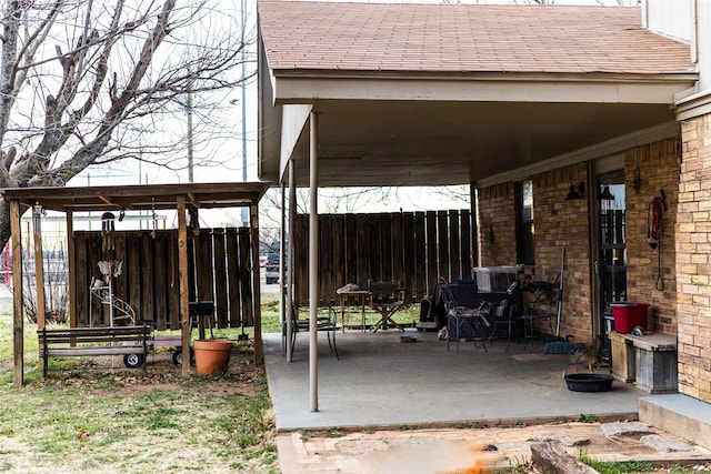 view of patio / terrace featuring fence