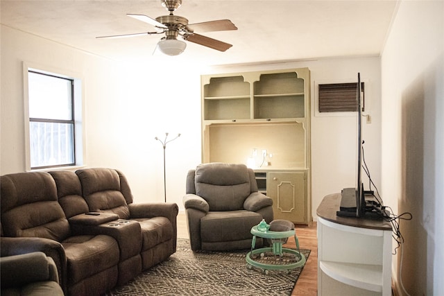 living room with ceiling fan and wood finished floors