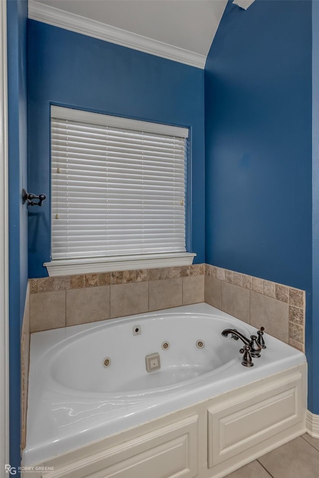 full bathroom featuring a whirlpool tub, ornamental molding, and tile patterned floors