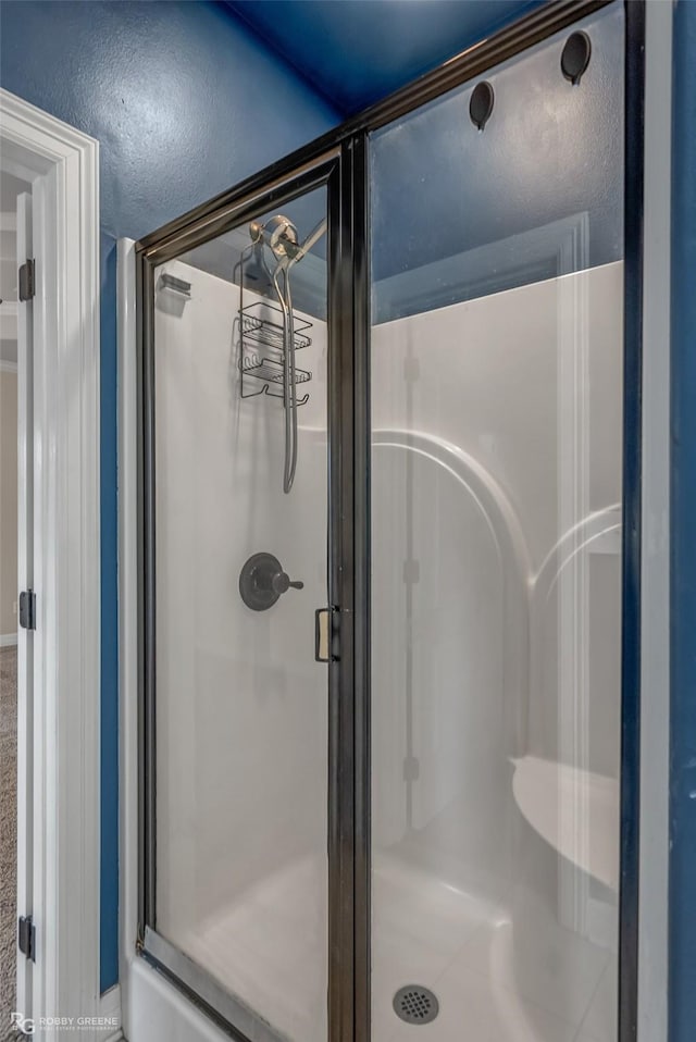 bathroom featuring a stall shower