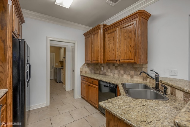 kitchen featuring crown molding, visible vents, backsplash, a sink, and black appliances