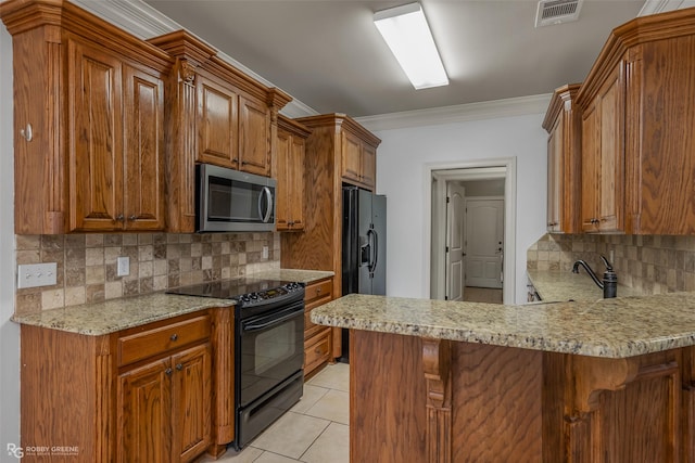 kitchen featuring light tile patterned floors, visible vents, brown cabinets, crown molding, and black appliances