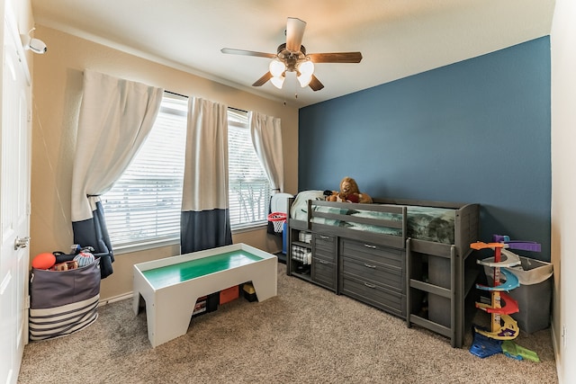 carpeted bedroom featuring ceiling fan