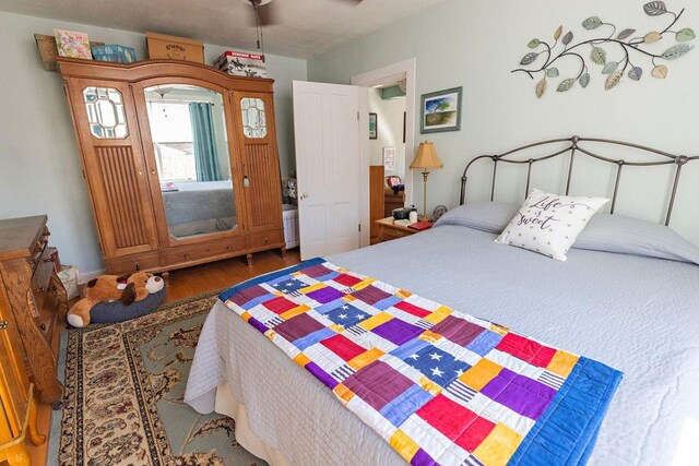 bedroom featuring wood finished floors