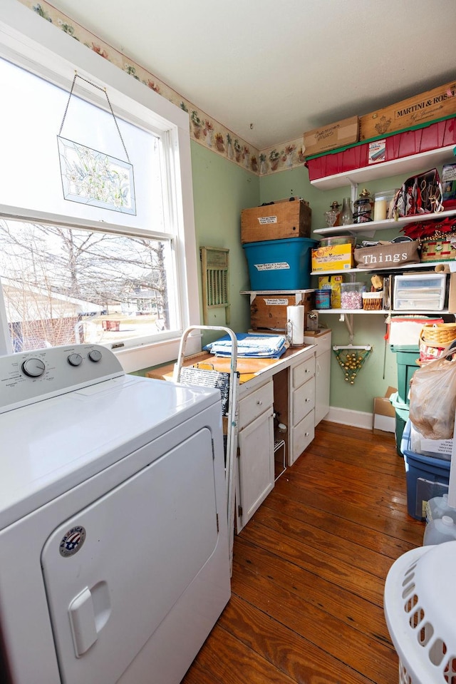 clothes washing area featuring independent washer and dryer, wood finished floors, and laundry area