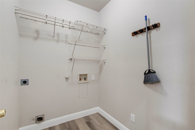 washroom with gas dryer hookup, washer hookup, laundry area, wood finished floors, and electric dryer hookup