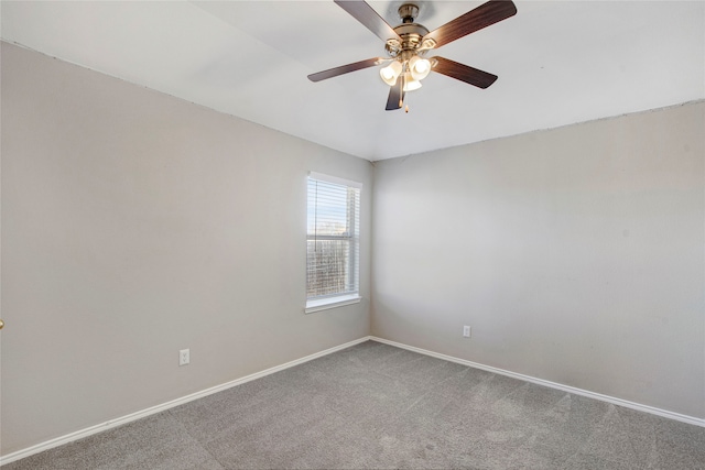 empty room with ceiling fan, baseboards, and carpet floors