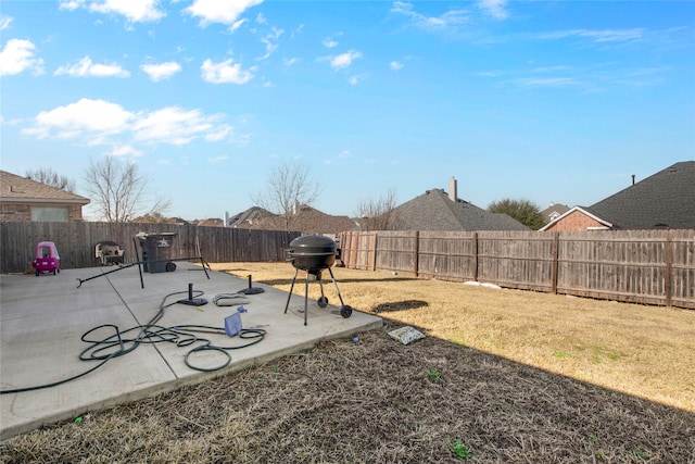 view of yard featuring a patio and a fenced backyard