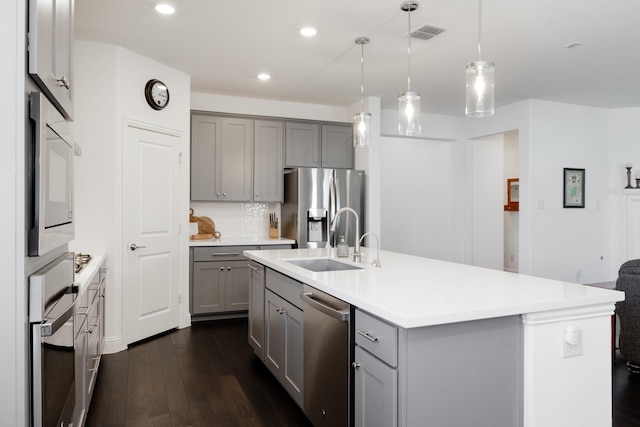 1624 Thunderbird Dr, Fort Worth, TX 76052 - kitchen with gray cabinets, appliances with stainless steel finishes, a sink, and visible vents
