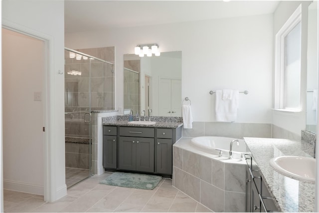 1624 Thunderbird Dr, Fort Worth, TX 76052 - bathroom featuring two vanities, a shower stall, a garden tub, and a sink
