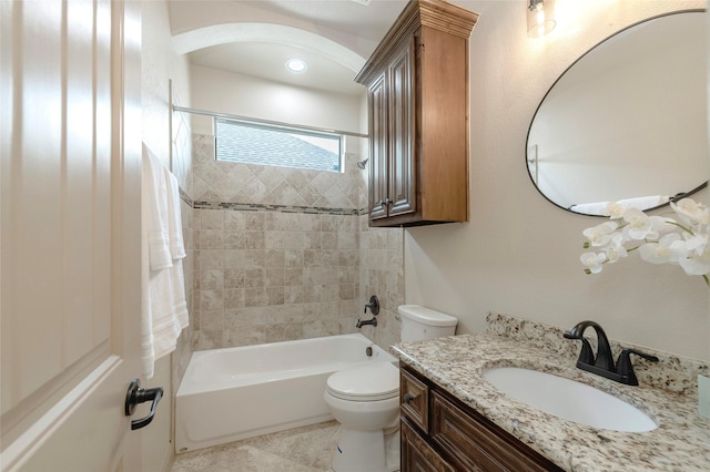 full bath with tub / shower combination, vanity, toilet, and tile patterned floors