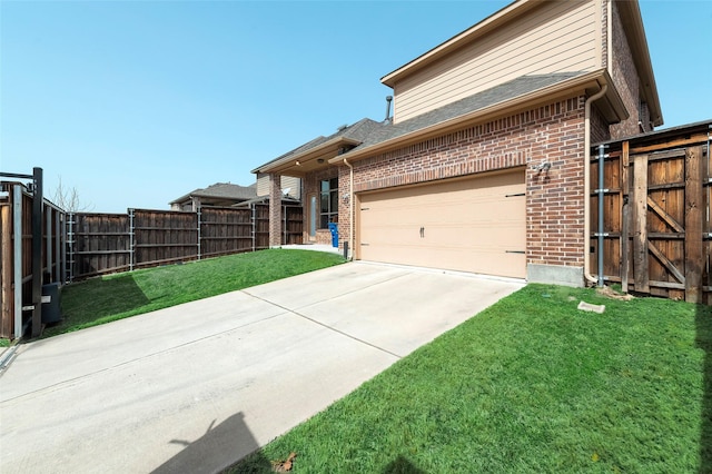 view of front facade with a garage, brick siding, fence, and a front lawn