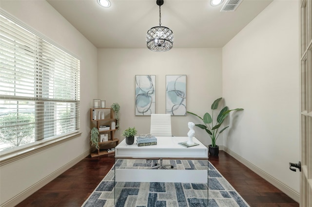 office with dark wood-style flooring, visible vents, and baseboards