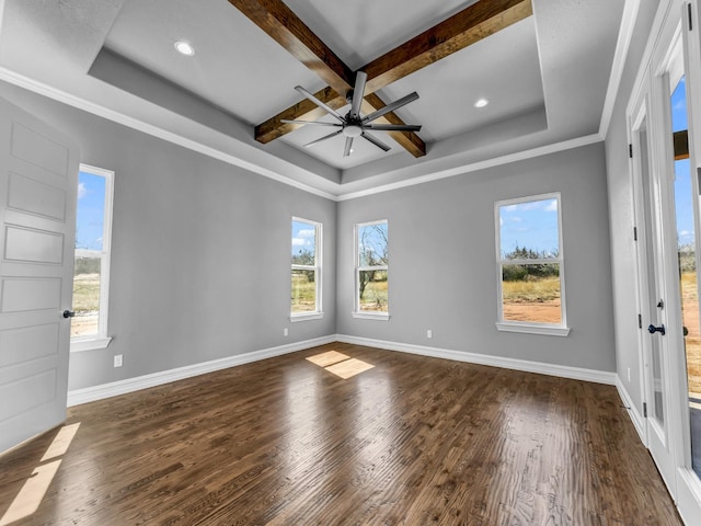 unfurnished room featuring dark wood-style floors, plenty of natural light, and baseboards