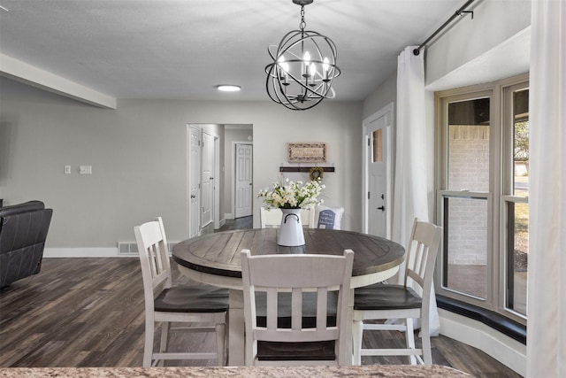 dining area featuring baseboards, visible vents, a chandelier, and dark wood-type flooring