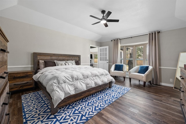 bedroom with lofted ceiling, ceiling fan, baseboards, and wood finished floors