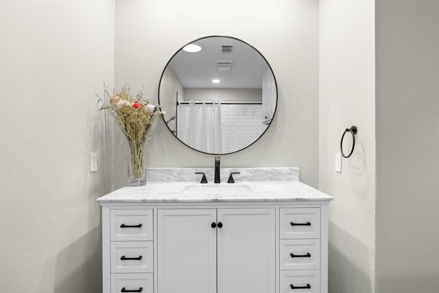 bathroom featuring visible vents and vanity