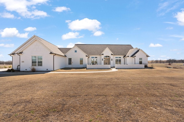 back of house featuring a lawn