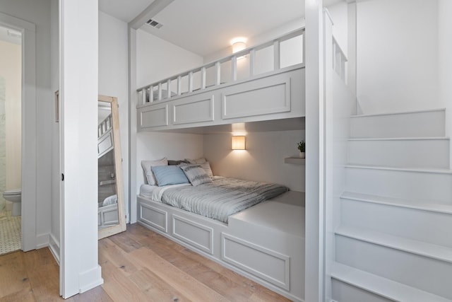 bedroom with light wood finished floors