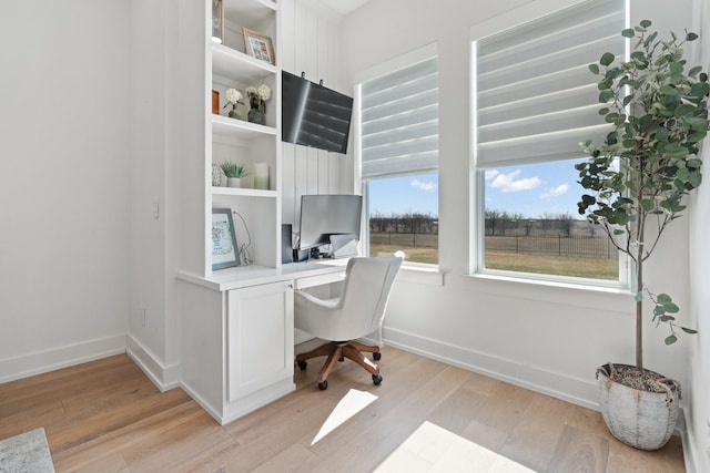 office featuring light wood finished floors and baseboards