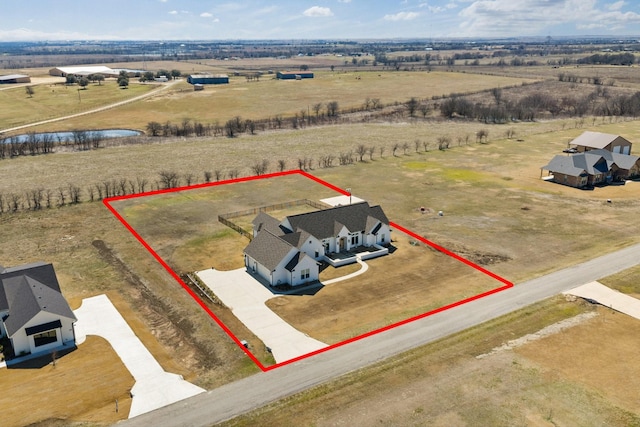 birds eye view of property featuring a rural view