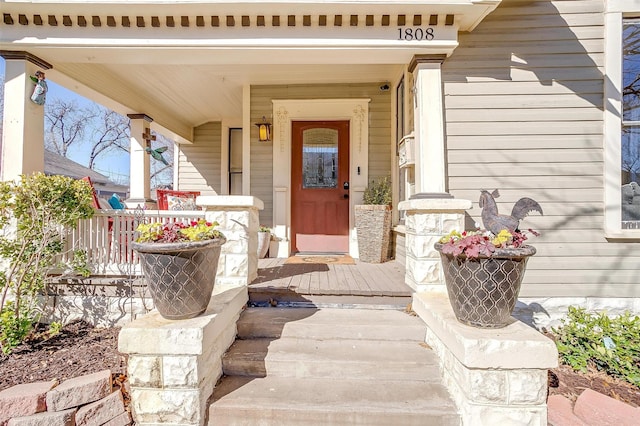 doorway to property featuring a porch