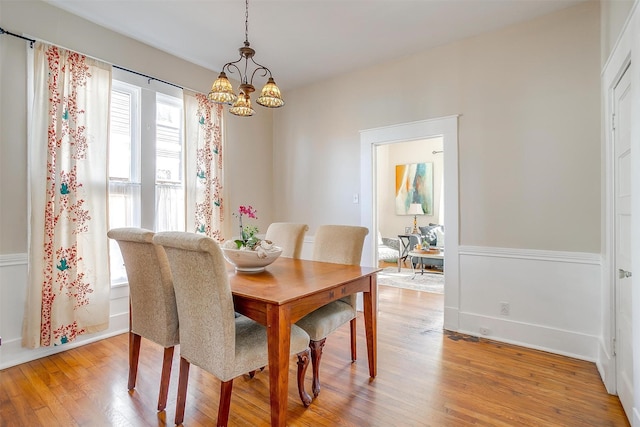 dining area with light wood-style flooring