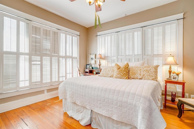 bedroom featuring light wood-type flooring and a ceiling fan