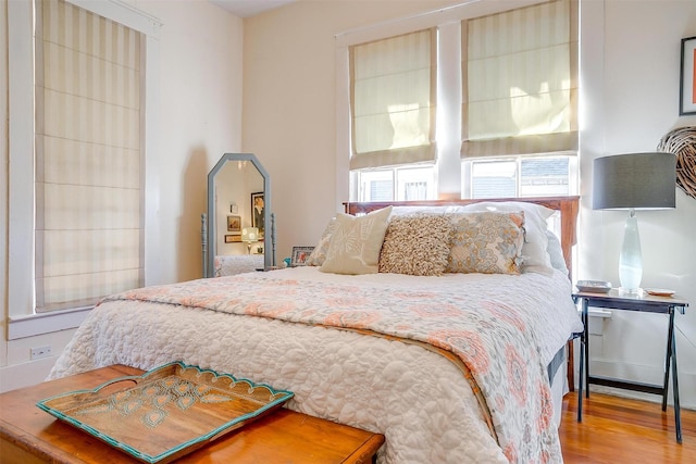 bedroom with wood finished floors