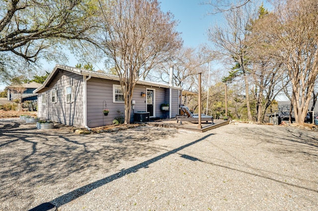 back of property featuring a deck