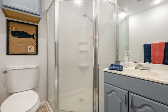 bathroom featuring toilet, a shower stall, recessed lighting, and vanity