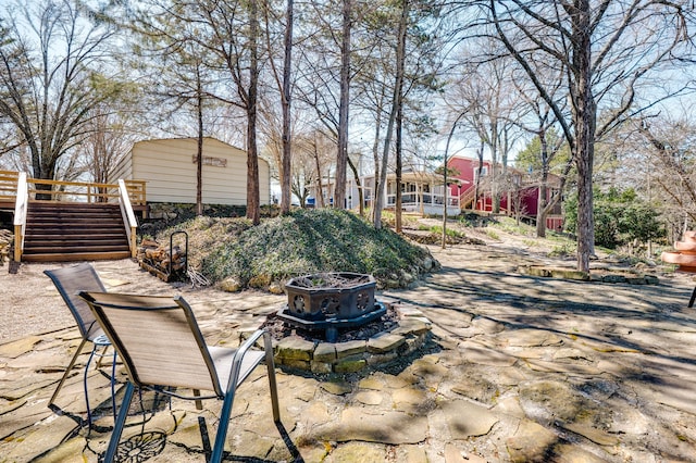 view of patio with stairs and a deck