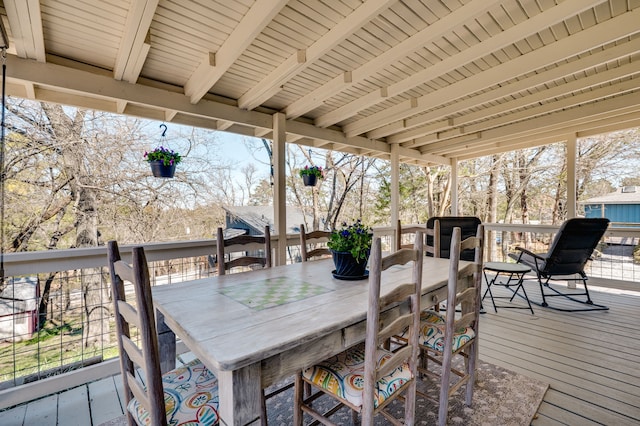 wooden deck with outdoor dry bar and outdoor dining area