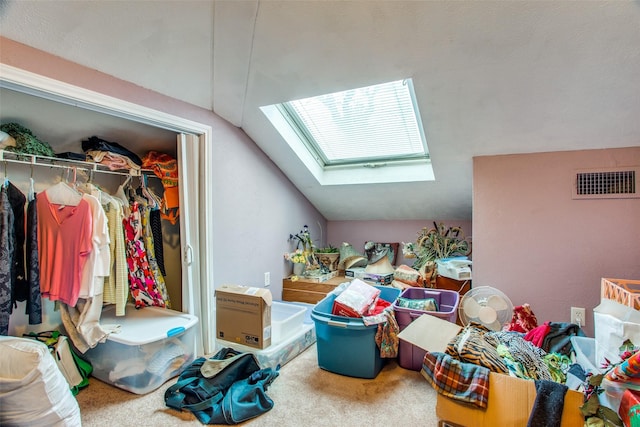 bonus room featuring lofted ceiling with skylight, visible vents, and carpet flooring