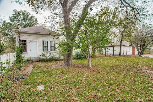 view of yard featuring entry steps and fence