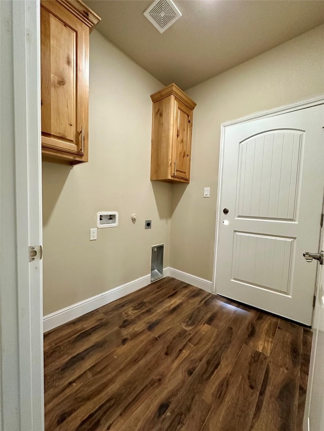 washroom with washer hookup, dark wood finished floors, visible vents, cabinet space, and hookup for an electric dryer