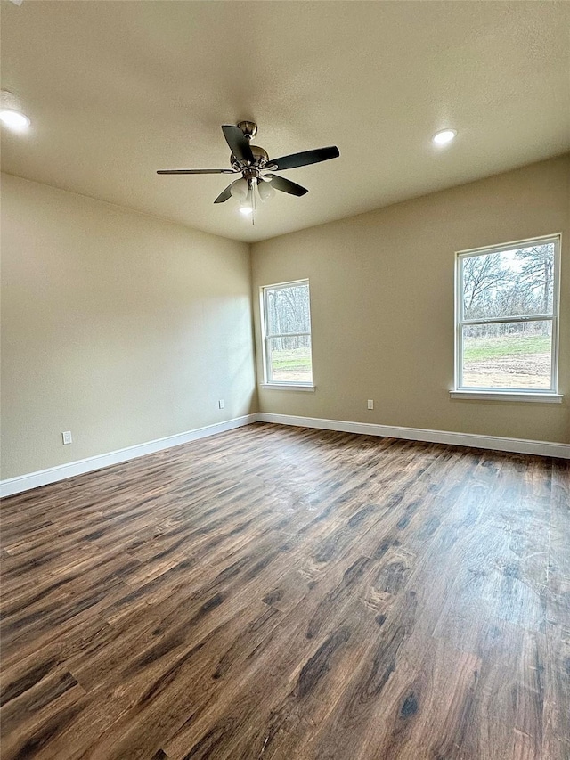 unfurnished room with dark wood-style floors, ceiling fan, baseboards, and recessed lighting