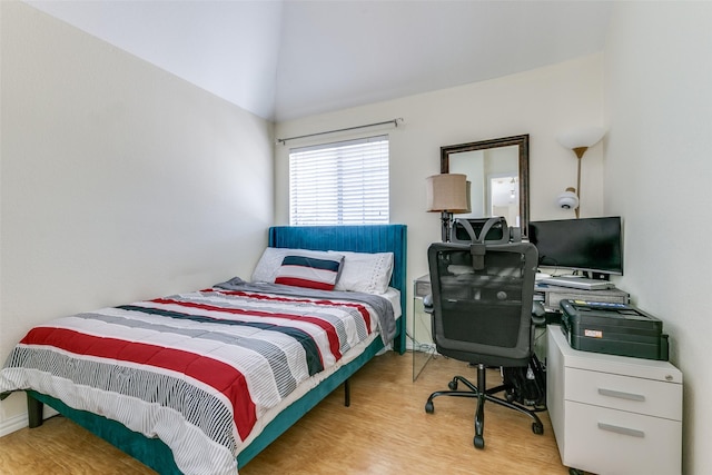 bedroom featuring wood finished floors